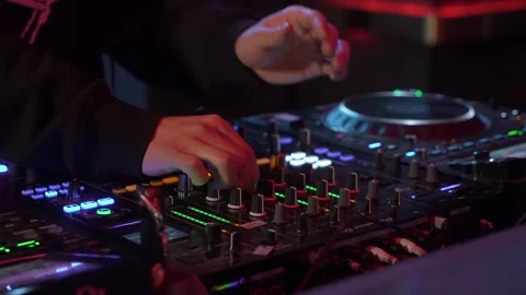 Intimate Image Capturing DJ Finetuning Mixer With Vibrant Neon Lights And Moody Stock Footage 323774164