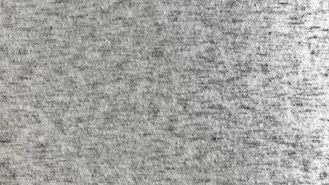 Intimate macro closeup captures intricate gray woven fabric texture in subtle Stock Photos