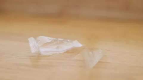 Intimate macro photograph capturing small wrapper debris details. Detailed macro Stock Footage 335957164