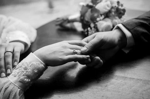 Intimate Moment of Commitment in Black and White Stock Photos