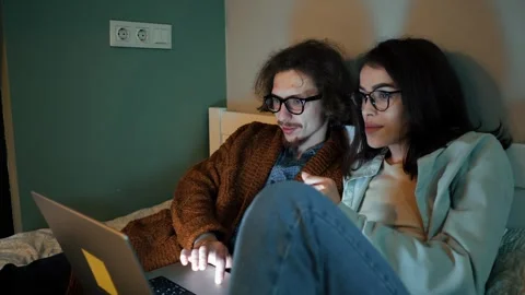 Intimate Moment of Couple Using Laptop Stock Footage 273708333
