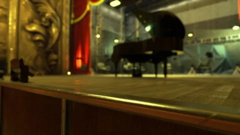 Intimate musical environment featuring warm glow and blurred audience background Stock Footage 339796554