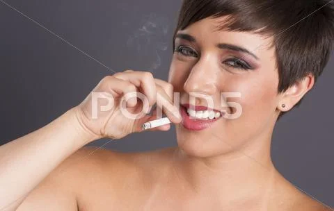 Intimate portrait female smoker addiction woman smoking cigarette smiling Stock Photos