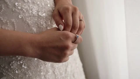 Intimate Solitaire Ring Twist on Sparkling Bridal Fabric Stock Footage 320222078