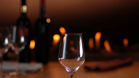 Intimate, warm atmosphere with slow motion pouring of red wine Video stock 63380985