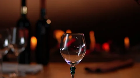 Intimate, warm atmosphere with slow motion pouring of red wine Stock-Footage 63381214