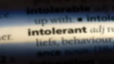 Intolerant word in a dictionary. Video stock 99561498