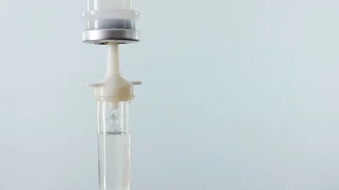 Intravenous drip chamber on white background Stock Footage 73565444