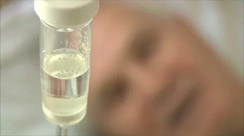 Intravenous drip  man, face out of focus Stock-Footage 8679535