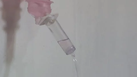 Intravenous Fluid Drop Falling Into Transparent Plastic Medical Infusion Reservo Video stock 342477443