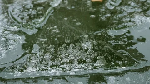 Intricate air bubble patterns in cracked ice. Zoom in Stock Footage 334850139