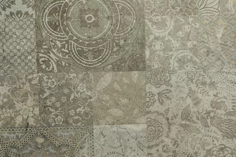 Intricate and textured patchwork design showcasing detailed patterns and muted Foto stock