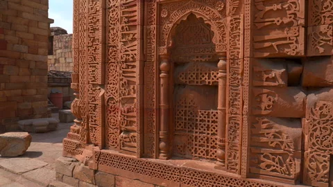 Intricate Arabic calligraphy and stone carvings at Qutub complex in New Delhi Stock Footage 342268515