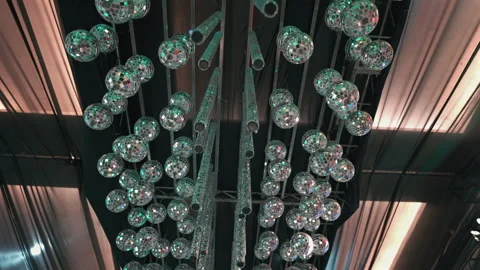 Intricate Array of Hanging Disco Balls Reflecting Colorful Lights Stock Footage 334169339