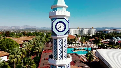 Intricate Clock Tower with Mosaic Patterns in Resort Area Stock Footage 296515048