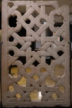 Intricate decorative stone panel with geometric patterns Stock Photos