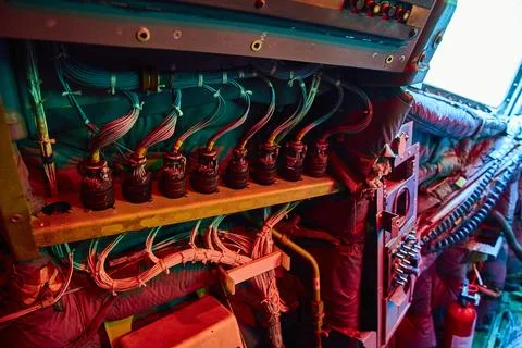 Intricate Electrical Components in Industrial Setting with Teal and Red Lighting Foto stock
