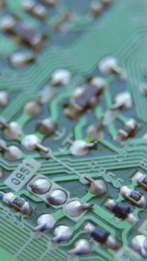 Intricate electronic circuit board traces and components macro view Video stock 334168954