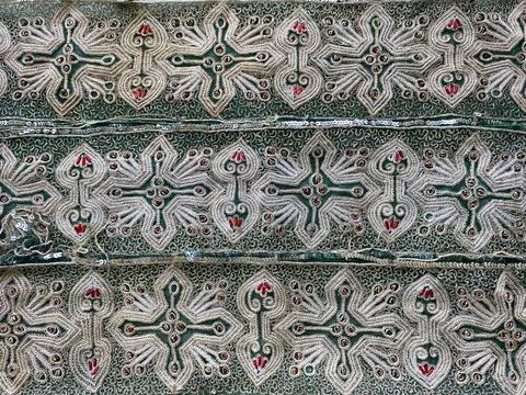 Intricate geometric hand-embroidered pattern border Stock Photos