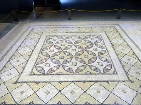 Intricate geometric pattern of ancient roman mosaic floor Stock Photos