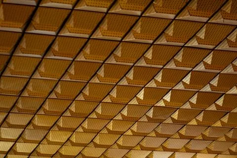 Intricate Geometric Patterns of a Textured Ceiling with Triangular Elements.. Stockfoto's