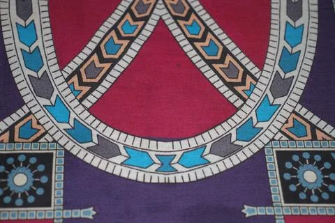An intricate geometric textile pattern with vibrant tribal motifs. Stock Photos