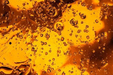 Intricate golden bubbles pattern in liquid macro abstract luxury background Stock Photos