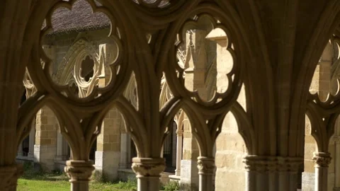 Intricate gothic stone tracery windows looking into the courtyard of the Видео 339130058