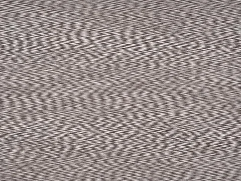 Intricate herringbone pattern in shades of brown on a textured veneer surface Foto stock