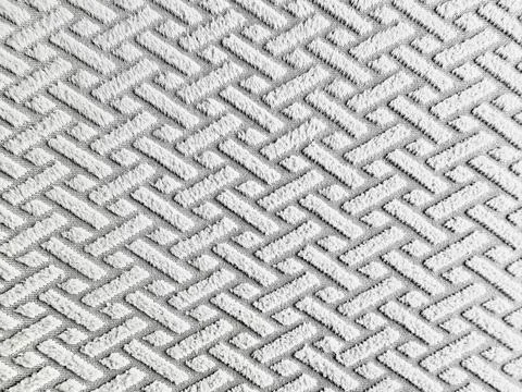 Intricate herringbone weave captures soft plush white fabric texture in detai Stock Photos