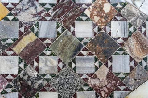 Intricate marble mosaic floor pattern in Venice, diamond-shaped tiles in varied Stock Photos