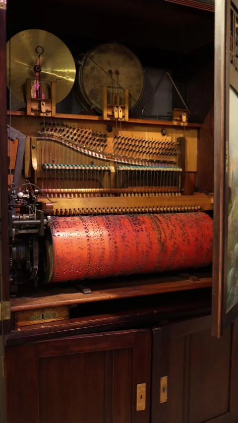 An intricate mechanical orchestrion with exposed components, including drums, st Stock Footage 293563876