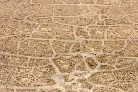Intricate patterns on cracked ground showcasing drought conditions in a dry Stock Photos