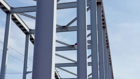 Intricate steel framework and red street light details on John Frost Bridge in Stock Footage 339837080