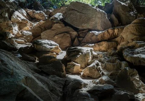 The intricate sunlight shining through down to Stalagmites inside Cave of H.. Stock Photos