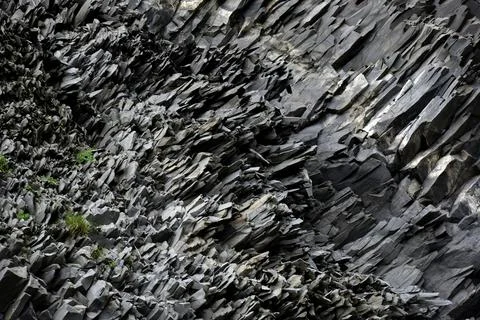 Intricate texture of volcanic basalt columns on Reynisfjall mountain Iceland Stock Photos