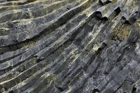 Intricate texture of volcanic basalt columns on Reynisfjall mountain Iceland Stock Photos