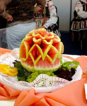 Intricate Watermelon Slice Pattern Adorns a Vibrant Platter at a Festive Cu.. Stock Photos