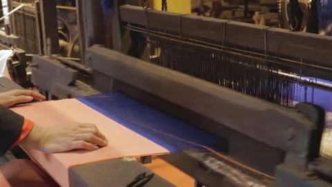 Intricate weaving process at a textile workshop in a bustling factory 스톡 동영상 308835885