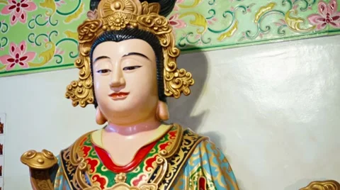 Intricately Painted Statue of the Buddha inside a Chinese Temple 库存影片 53615962