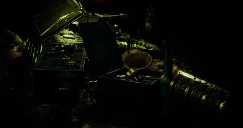 An intriguing collection of treasures and artifacts fills the dark workspace Illustration