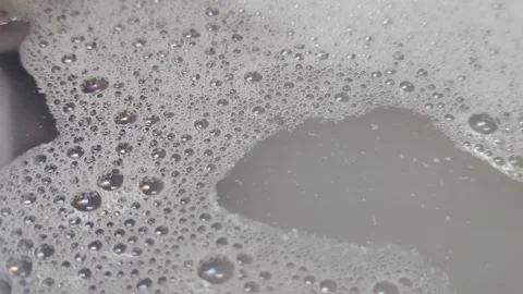 Intriguing Macro Shot of Soap Bubbles in Water, Relaxing and Calming Stock Footage 295289318