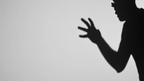 Intriguing Shadow Play with Hands and Human Silhouette 库存影片 311933183