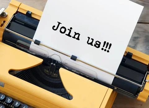 Introducing a Join Us recruitment campaign with a yellow typewriter showin... Stock Photos