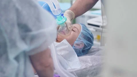 Introducing a patient to anesthesia before surgery Stock Footage 150887276