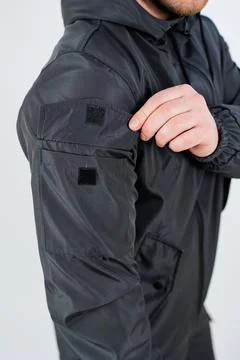 Introducing a Stylish and Highly Functional Black Jacket that Showcases a U.. Stock-Fotos