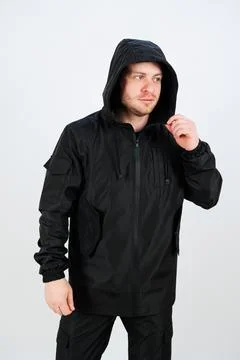 Introducing a stylish black jacket complete with a hood, perfect for a vari.. Foto stock