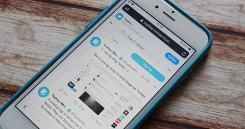 Introduction clip of Twitter Write on its Twitter account on an iPhone Stock Footage 207549234