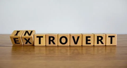 Introvert or extrovert symbol. Fliped cubes and changed the word 'introvert'  Stock Photos