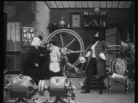An inventor points out his creations to some guests in 1908. Stock Footage 75757893